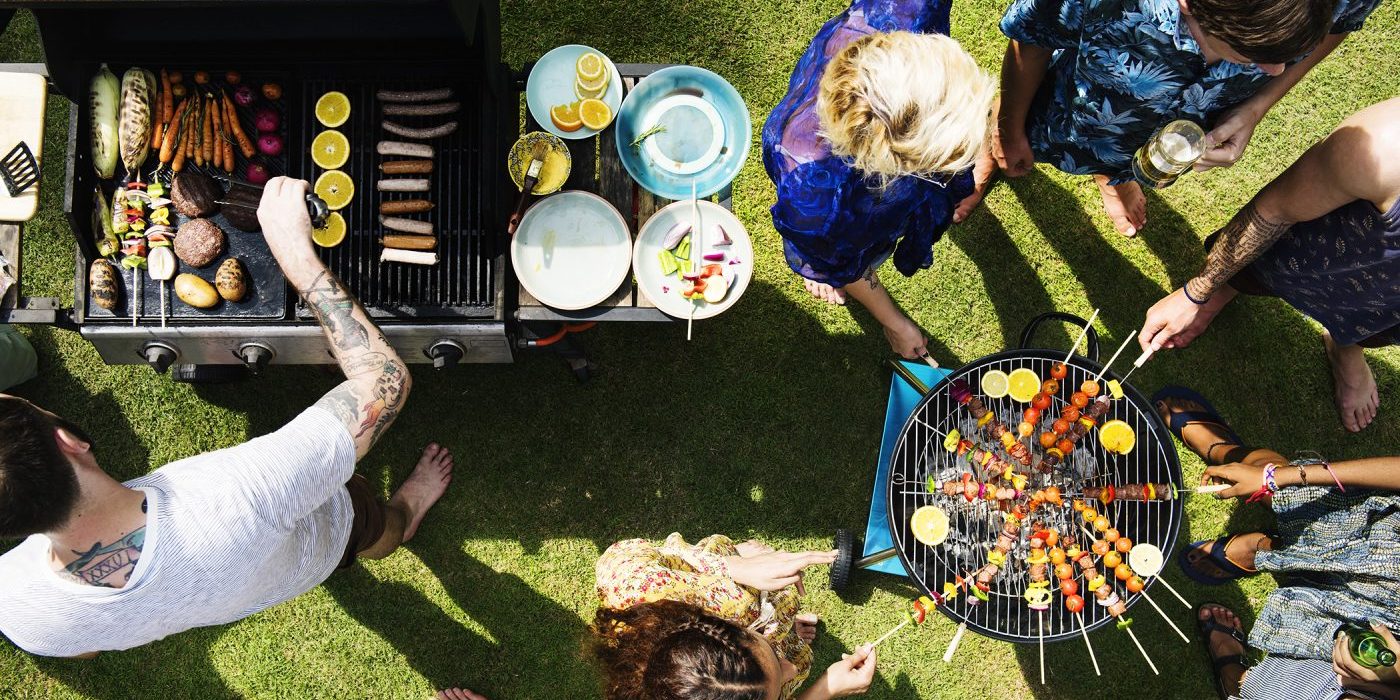 Friends Grilling outdoors Enjoying company of friends over bbq